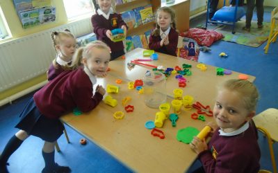 Juniors enjoying using playdough during playtime.