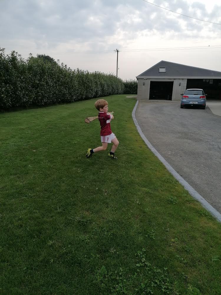 Jack practicing his hurling skills