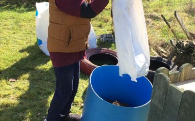 Budding Gardeners – Gathering the top soil for sowing the potatoes